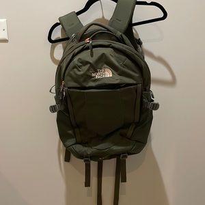 Brand new North Face back pack no tags. Army green with gold logo.